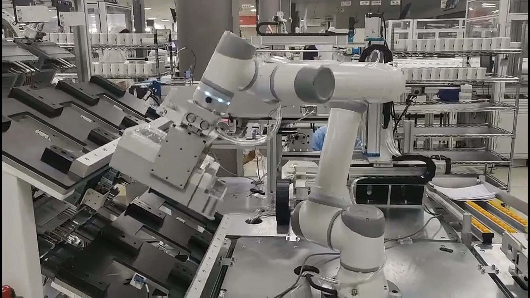 Medical and lab scene: collaborative robotic arm executing repeatable SOP pick-place on a bench.