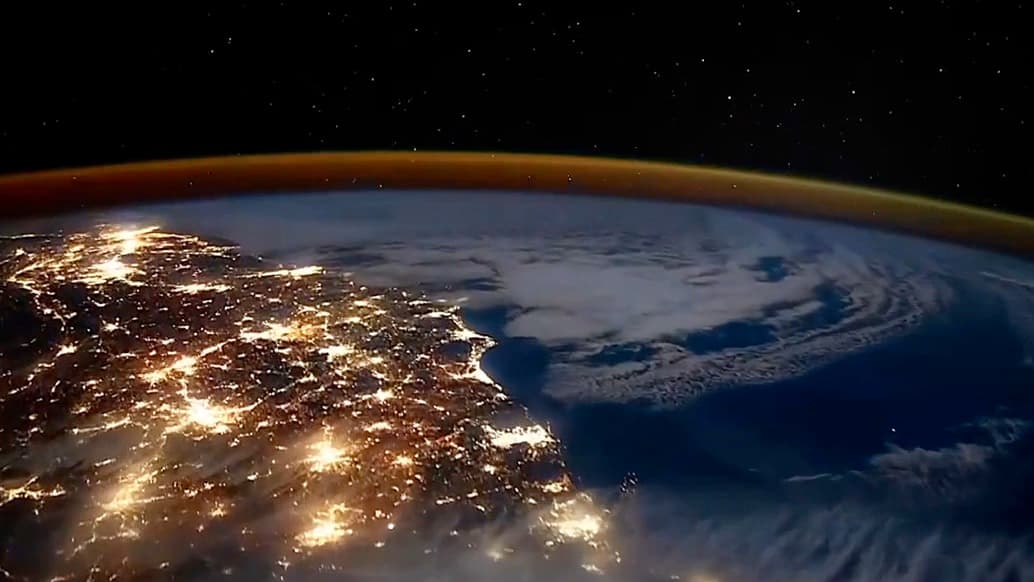 Orbital sunrise over Earth's horizon—atmospheric background for Roooll global service support.