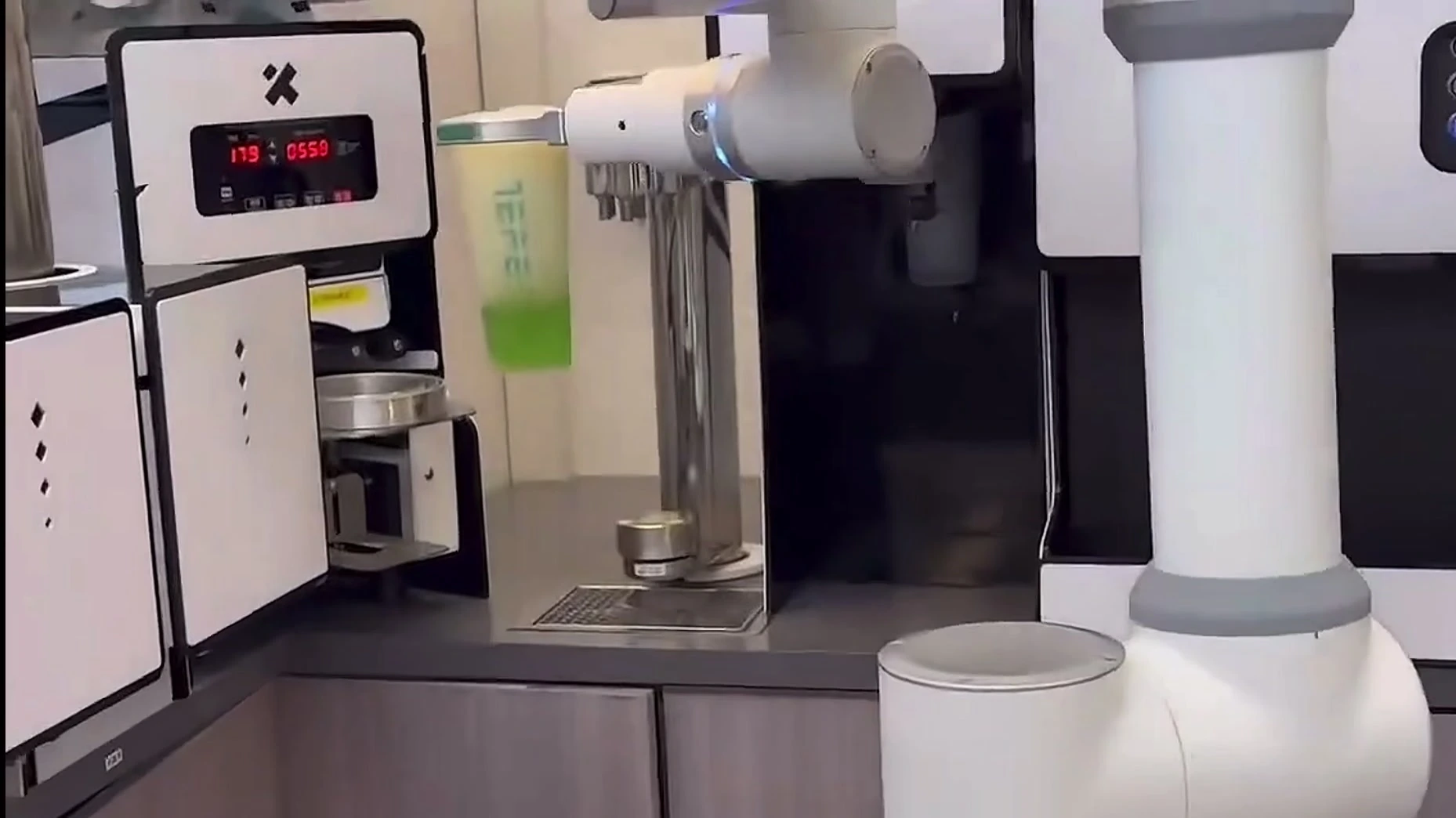 Retail and service application: collaborative robotic arm in a front-house beverage service scene.